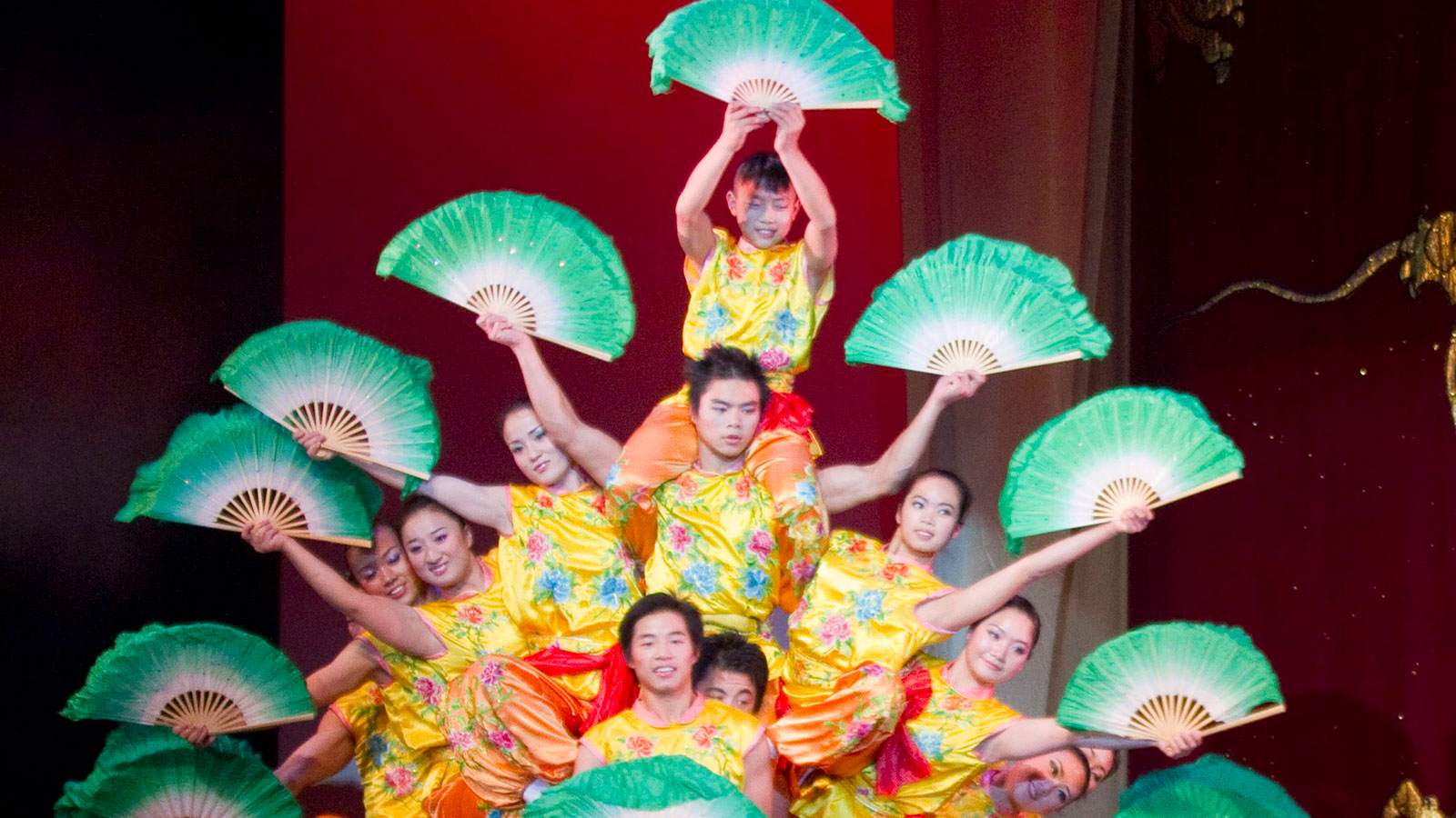 Peking Acrobats troupe performing precision tumbling with live Chinese musicians in Ogden