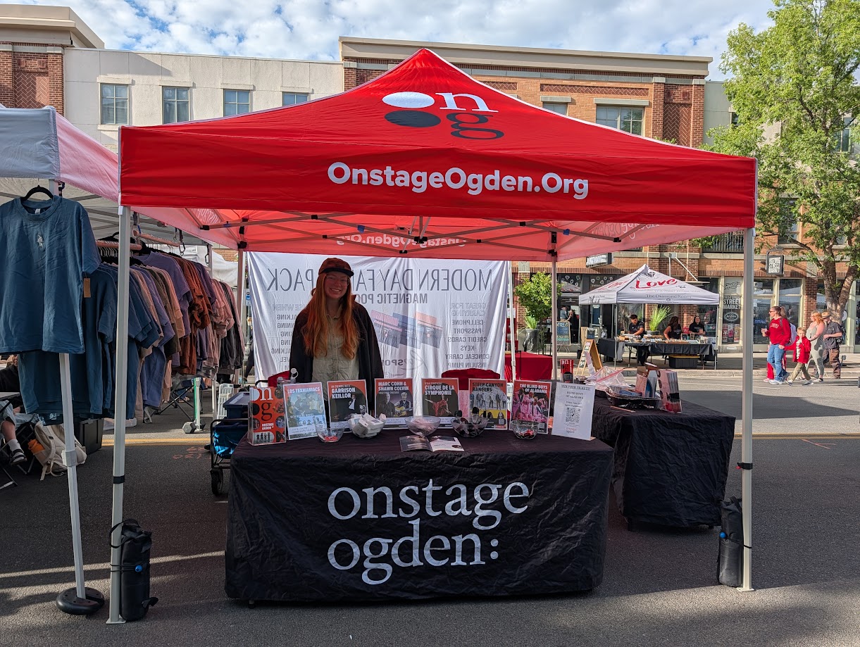 Onstage Ogden community outreach booth at a summer festival in Ogden Utah